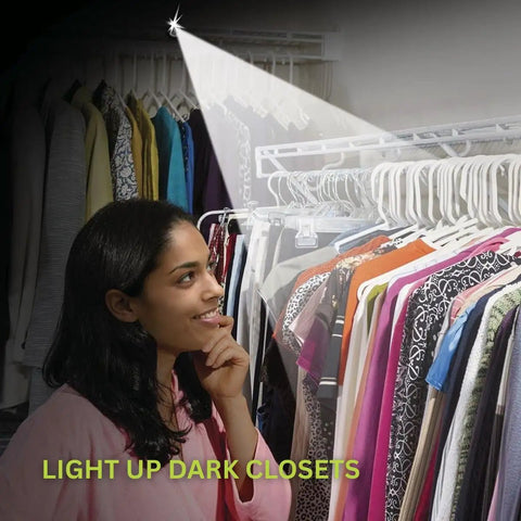 Woman using 20 Lumens Each Ultra Bright Button LED Lamps With Adhesive in a closet to illuminate dark clothing area.