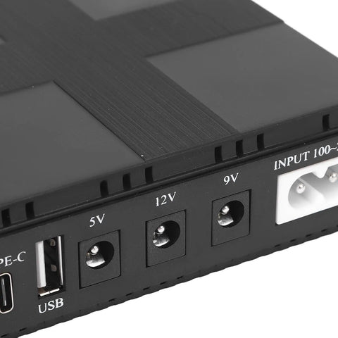 Close-up of Portable UPS Battery Backup Stores 20000 Mah Of Ready To Go Juice For Cameras Routers And Media Devices with ports.