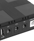 Close-up of the output ports on the Rock Solid 20000 Mah Ups Battery Backup Offering 18 Watt Output And Us Plug To Keep Your Routers Running No Sweat During Unexpected Power Outages At Home Or Office.
