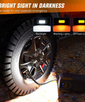 Digital Tire Inflator Portable Air Compressor Pump Tough Guy Workhorse with LED light filling a truck tire at night.