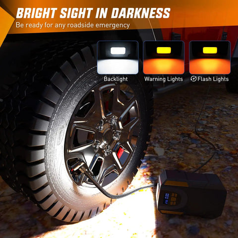 Digital Tire Inflator Portable Air Compressor Pump Tough Guy Workhorse with LED light filling a truck tire at night.