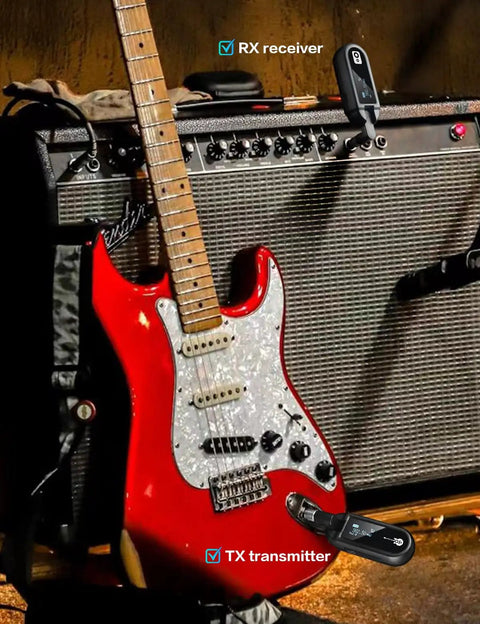 Red electric guitar with UHF Wireless Guitar System With Rechargeable Transmitter And Receiver on amplifier, gig setup.