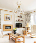 Glam Gold 13 Bulb LED Pendant Light Chandelier With Crystal Flower Shade in a modern living room.