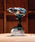 Brushless 18V Cordless Drill Driver With 13Mm Keyless Chuck And Dual Speed Gearing on wooden surface, showing metal gear housing.