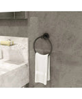 Dia 4-Piece Wall Mounted Bathroom Hardware Set In Matte Black With Hand Towel Holder, shown in modern bathroom setting.