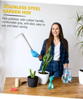 Person holding Stainless Steel Weeding Hoe Gardening Tool For Herb Garden Cultivator with plants on table