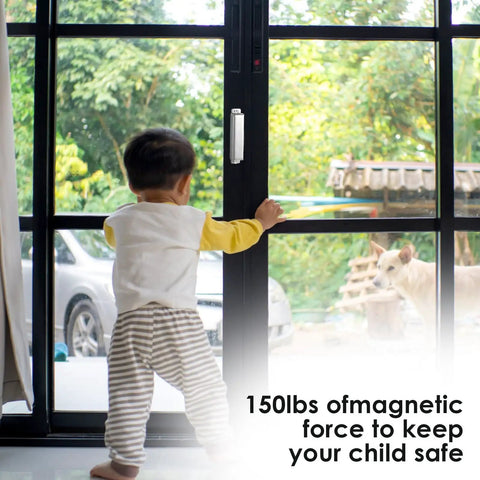 Child looking outside through a glass door held by a 4 Pack 150Lb Heavy Duty Magnetic Door Catches For Cabinets Closets Wardrobes Cupboards Kitchen Bathroom 3.74 Inch Stainless Steel With Screws Keeps Doors Snug And Secure.