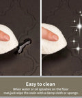 Close-up of 24 X 60 Inch Extra Thick Anti Fatigue Kitchen Mat, showing waterproof easy-to-clean surface being wiped clean