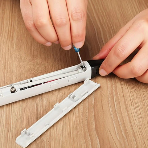 Hands using screwdriver on 3D pen with Replacement 3D Pen Nozzle For Pro 3D Printing Scribbler With Quick Snap In Design No Tools Needed