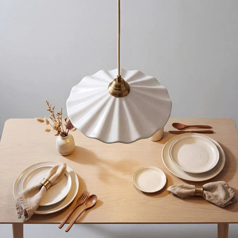 Premium White Scalloped Ceramic Pendant Light Adding Sweet Vintage Charm To Kitchen Islands Built Tough With Heat Resistant Glaze Handling Humidity Like A Champ Snag This Clean Modern Look Today hanging above a wooden table set with plates and utensils.