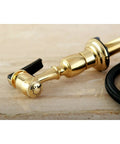 Kitchen Faucet Sprayer With Hose In Polished Brass, 60 Inch Grey Braided PVC Hose, One Touch Button Control close-up on beige surface