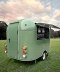 Ready To Rock 10ft Mobile Food Trailer Built On Galvanized Steel Frame With Sleek Mirror Exterior Perfect For Coffee Kiosks Snack Shacks Or Pop Up Catering Got Your Back Every Day, green rear view with open serving area.
