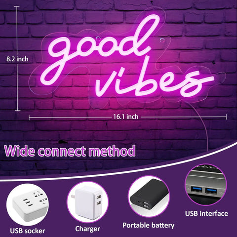 Good Vibes Pink Neon Sign With Dimmable USB Power Ultra Bright LED Wall Light For Bedroom And Home Bar Retro 70s Vibe Mood Decor 16.1 by 8.3 Inches Neon Light For Fun Atmosphere against brick wall with USB power options shown below