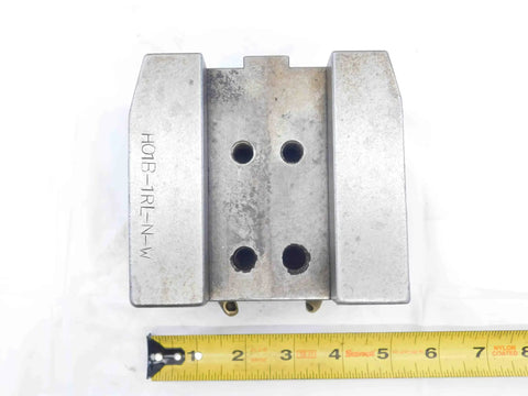 Top view of One Inch Slot Width Lathe Turret Tool Block With 40mm By 65mm Bolt Pattern H01B-1RL-N-W 1.0 with measuring tape