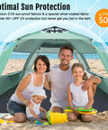 Family enjoying Deluxe XL Pop Up Beach Tent Sun Shade For 3 To 4 People With UV Protection And Extendable Floor, mint green.
