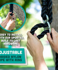 Close-up of hands attaching braided nylon rope with metal ring for heavy duty plastic disc swing with rope and leg protectors.