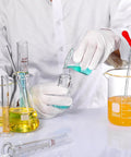 Scientist using Complete Lab Glassware Starter Kit with 50 100 250 500 1000ml beakers, graduated cylinders, and glass droppers