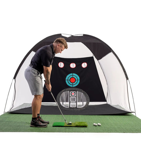 Man practicing with Massive 10x7ft Golf Practice Net Kit With Hitting Net Chipping Net Tri Turf Mat And Target Mat For Backyard Driving Indoor Or Outdoor Training Perfect Gift For Golfers And Dads.