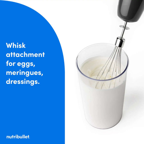 Heavy Duty Yet Slick Handheld Immersion Blender With Rugged Stainless Shaft And Versatile Whisk Hook for whipping cream in a clear cup.