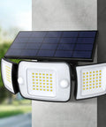 Close-up of Solar Backyard Flood Lights with 6000mAh Battery, dual motion sensor and waterproof construction mounted on a wall.