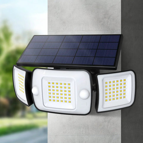 Close-up of Solar Backyard Flood Lights with 6000mAh Battery, dual motion sensor and waterproof construction mounted on a wall.