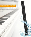 Heavy Duty Piano Hinges 20 Inch Long 2 Inch Open Width Black Stainless Steel With Holes next to piano keys