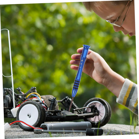 Child using Ultimate RC Car Screw Tool Kit, Metric Fasteners, Nuts and Bolts, Precision Bits on an RC car outdoors