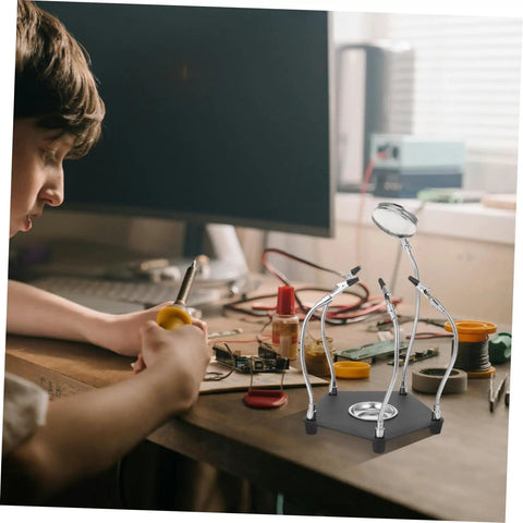 Young person using Magnetic Third Hand Soldering Aid With Built In Magnifier For Crafts And PCB Work, Pro Grade Stainless Steel Tool