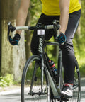 Cyclist with 8 Pack Bike Front And Rear Reflectors Kit For Bicycle Wheel Spoke Reflectors Set On Handlebar Riding On Road
