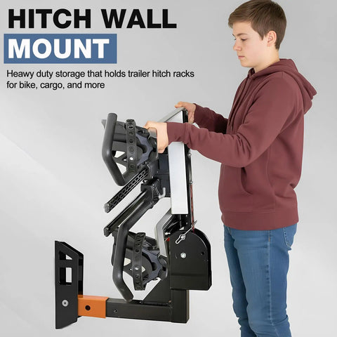 Beefy Steel Hitch Wall Mount Foldable Garage Saver For 2 Inch Receiver Easy Grip stowing bike rack by a young person.