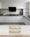 Magnetic Cabinet Door Catch With Screws For Cupboard Wardrobe Drawer Closure, shown on countertop with modern kitchen backdrop
