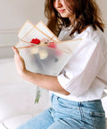 Person holding bouquet wrapped in Floral Bouquet Wrapping Paper Waterproof Protective Wrap Paper 20 Sheets Cuttable For Flowers And Bouquets