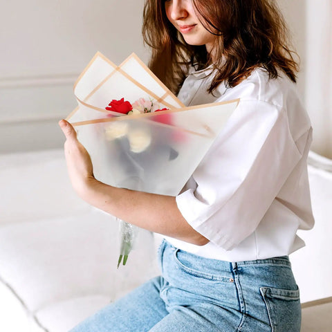 Person holding bouquet wrapped in Floral Bouquet Wrapping Paper Waterproof Protective Wrap Paper 20 Sheets Cuttable For Flowers And Bouquets