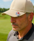 Man wearing a tan hat with Ukiyoe Wave Golf Ball Marker with Magnetic Hat Clip made from zinc alloy, Great Wave design visible.