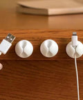 6 Pack Desk Cable Organizer Clips For Wire Management Adhesive Cord Holders in use on an office desk, securing charging cables.