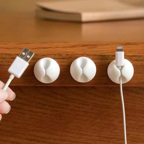 6 Pack Desk Cable Organizer Clips For Wire Management Adhesive Cord Holders in use on an office desk, securing charging cables.