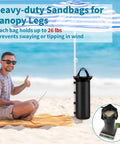 Four Heavy Duty Sand Bags For Canopy And Gazebo Legs Extra Large 6 By 20 Inch Sand Bags shown on beach with umbrella.
