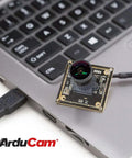 1080P Low Light WDR USB Camera Module with Microphone connected to laptop, showcasing Ultra Wide 160 Degree Fisheye Lens, 2MP IMX291