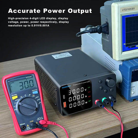 High Precision DC Power Supply with Encoder Knob 30V 10A on bench with multimeter and display showing voltage, current readings.