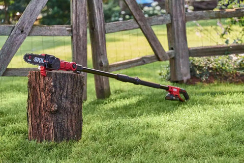 Solid Build Cordless Pole Saw With Eight Inch Bar And Ten Foot Reach To Clear High Limbs Like A Pro resting on a tree stump in the yard.