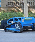 Remote Control Lawn Mower With RC Tracks For Slopes And Uneven Ground, wireless heavy duty grass cutter on pavement near trees.