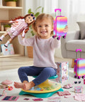 Child holding 18 Inch Doll Travel Play Set with luggage, doll, and accessories for imaginative adventures in real-life vibes.