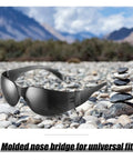 48 Pairs Safety Glasses Protective Eyewear Goggles For Men Women Work 4 Boxes Of 12 Scratch Resistant, displayed on rocky terrain