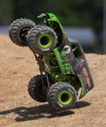 Grave Digger 1 To 18 Scale Mini LMT 4X4 RC Monster Truck RTR with 2S battery and charger, green body, doing a wheelie on dirt