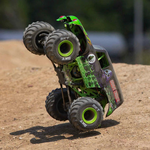 Grave Digger 1 To 18 Scale Mini LMT 4X4 RC Monster Truck RTR with 2S battery and charger, green body, doing a wheelie on dirt