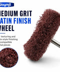 1 1 2 Inch Medium Grit Satin Finish Abrasive Buff Wheel With 1 8 Inch Shank mounted for rotary tools, showing textured surface.
