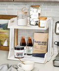 Countertop Coffee Station Organizer With Mug Holder And Bar Accessories Keeps Your Coffee Bar Neat And Accessible Cup Rack For Mugs And Cups Kitchen Countertop Organizer Perfect Gift For Coffee Lovers in kitchen setting with cups and coffee supplies.