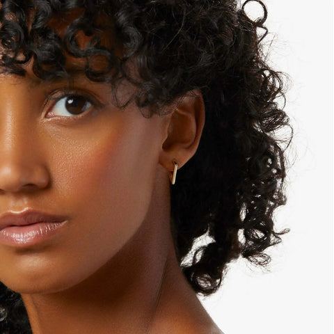 14K Gold Hoop Earrings For Women, Minimalist V-Shaped Open Hoops, Hypoallergenic And Lightweight 17mm Design on model.