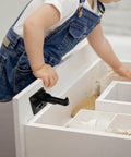 No Drill Childproof Cabinet Locks Pack Of 12 With Strong Adhesion And Easy Install For Drawers Cabinets And Doors Safe Furniture Locks For Kid Proofing shown securing a white drawer to prevent toddler access.