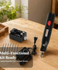12V Electric Mini Drill Pen With Custom Speed Dial Ergonomic Compact Rotary Tool Lightweight Precision Carving Engraver with attachments on wood table.